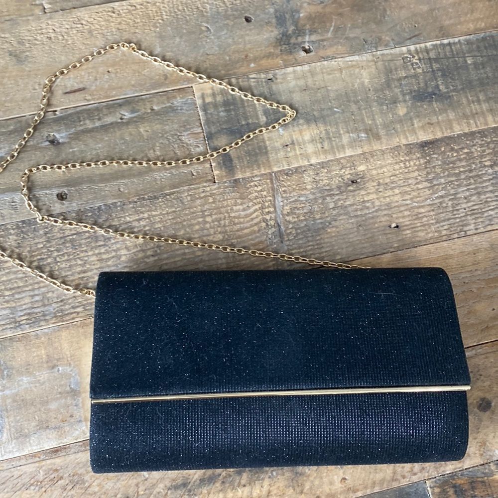 Black sparkly shoulder bag with gold chain strap and gold details